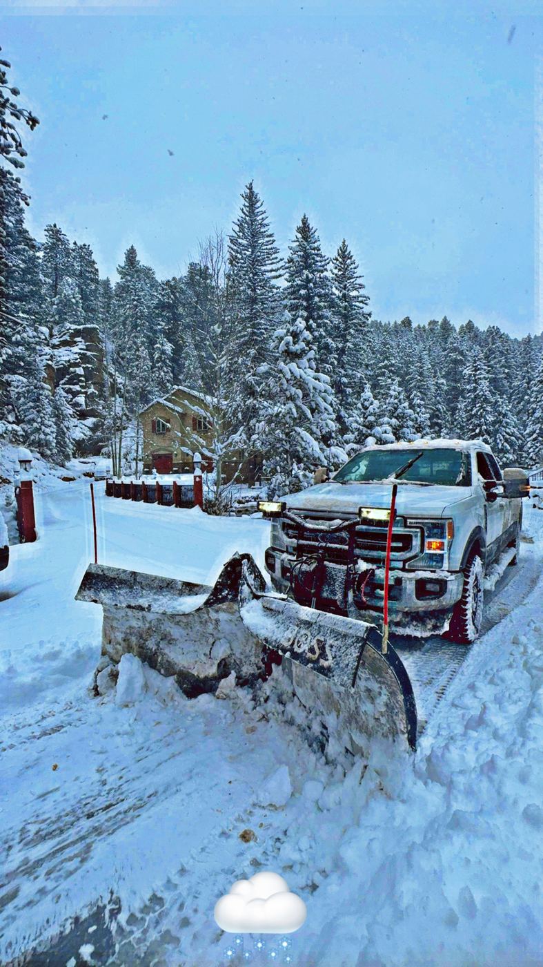 Lawn Smiles plow truck clearing snow